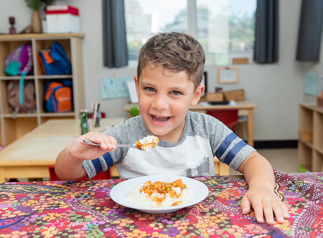 First Grammar day care child eating nutritious food