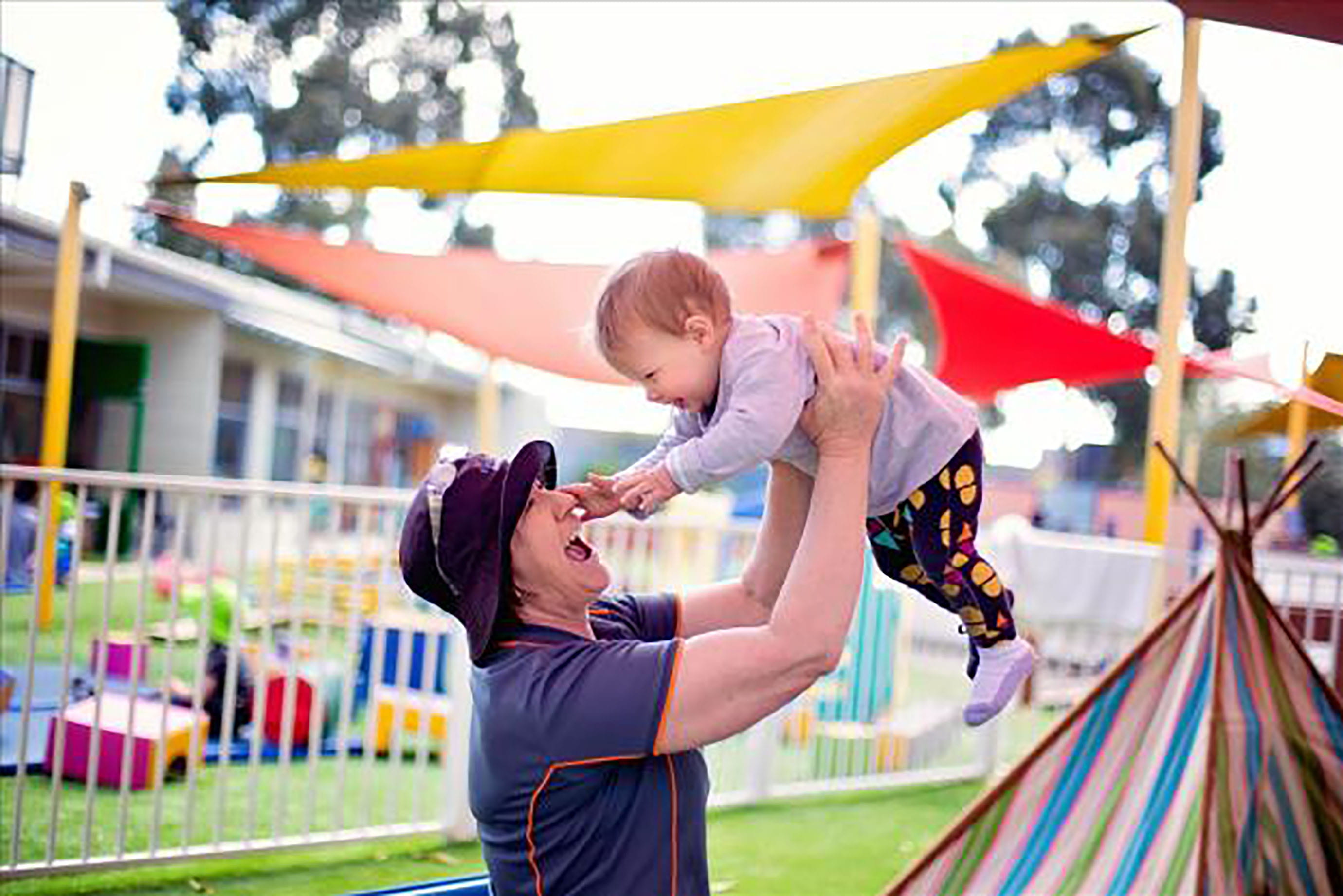 Bendigo child care educator playing with a baby