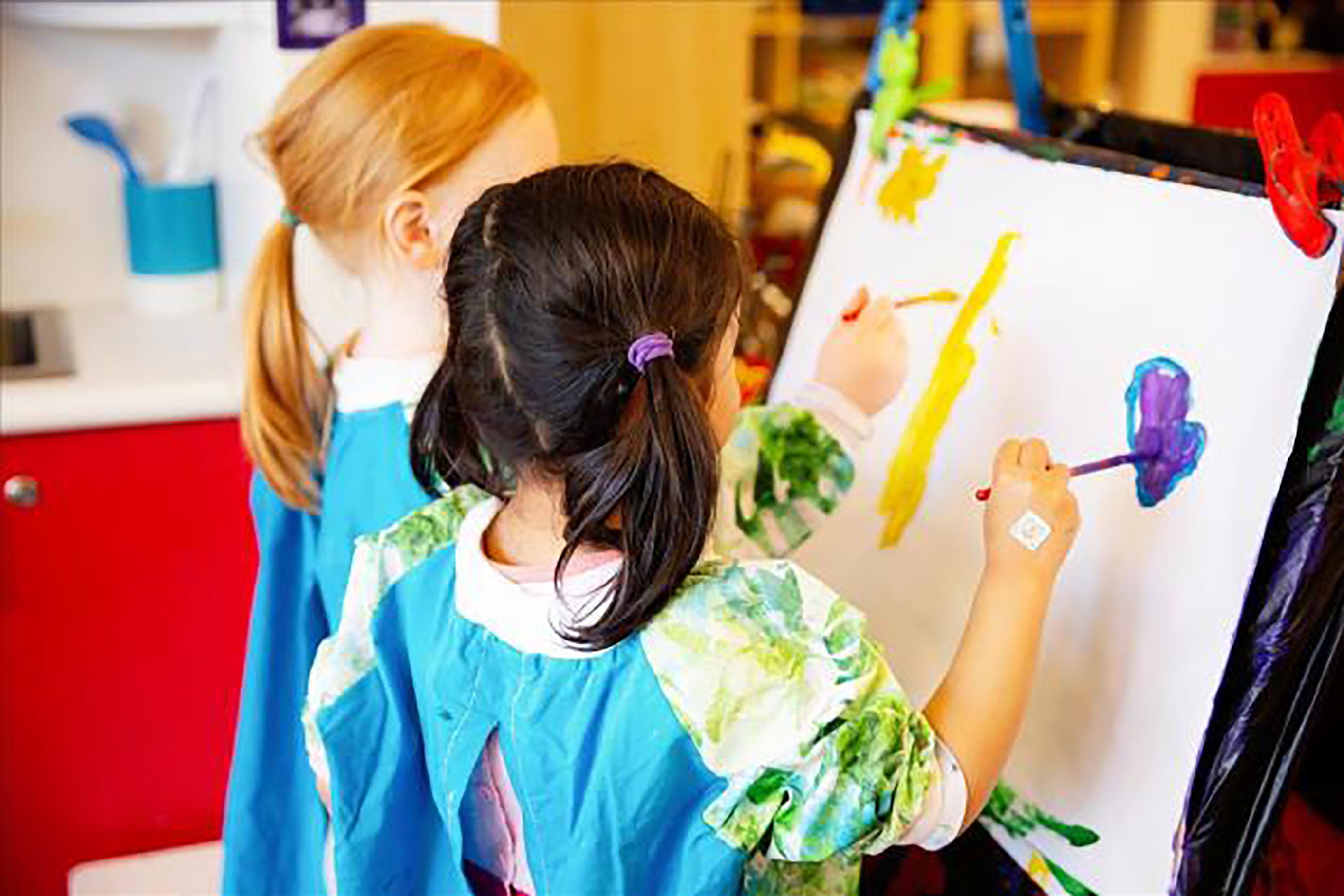 Kindergarten children painting