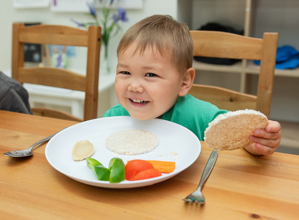 First Grammar child care toddler with a nutritious food